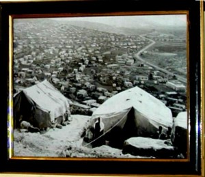 early refugee camp, tents and small huts